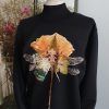 sudadera negra producción sostenible