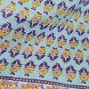 foulard pareo con estampado floral en turquesa, marino y amarillo