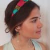 diadema fiesta bordada en fucsia y turquesa